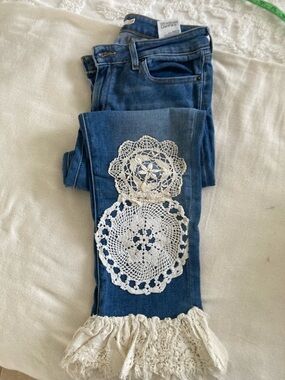 Levi's Blue Cropped Jeans with White Crochet Appliqués and Fringe